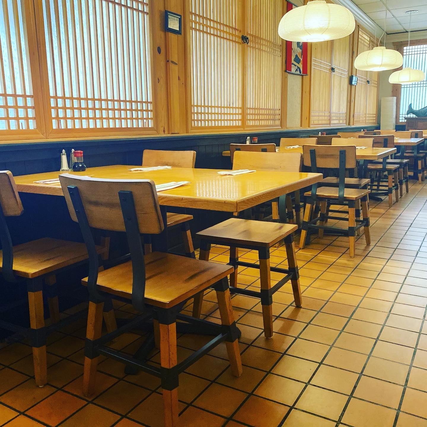 The warm wood-and-shoji dining room inside Ozeki Japanese Restaurant